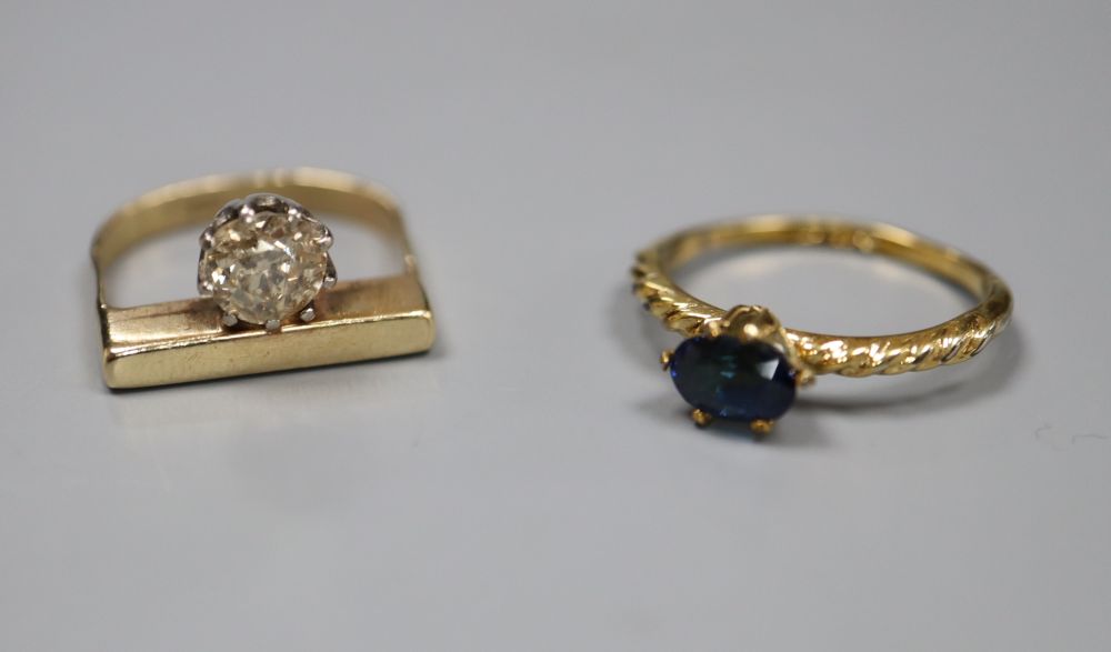 A modern yellow metal and solitaire diamond ring, size G, gross 4.5 grams and a sapphire set ring.